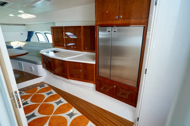Slide: The Image of Luxurious interior of 2017 Intrepid 475 Sport Yacht with modern kitchen and stylish decor. - 56