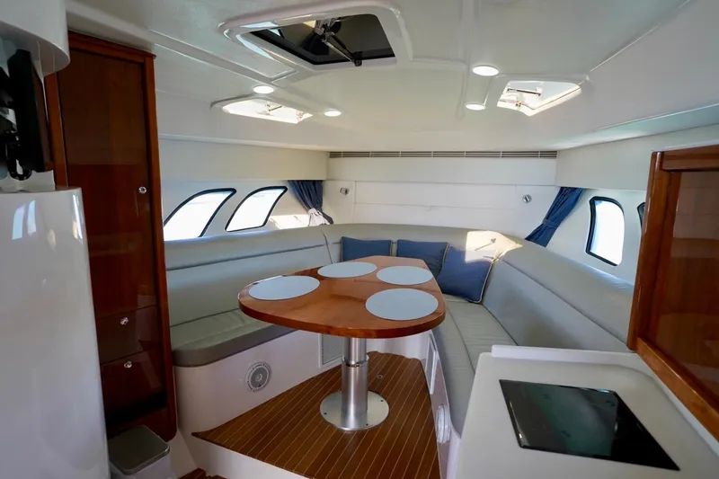 Slide: The Image of Luxurious interior of 2017 Intrepid 475 Sport Yacht with elegant seating and dining area. - 58