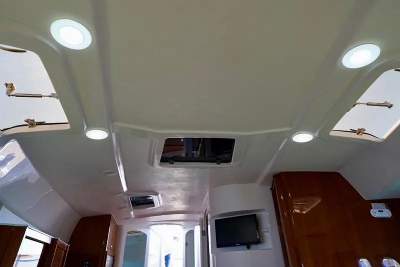 Slide: The Image of Interior ceiling view of a 2017 Intrepid 475 Sport Yacht with skylights and recessed lighting. - 61