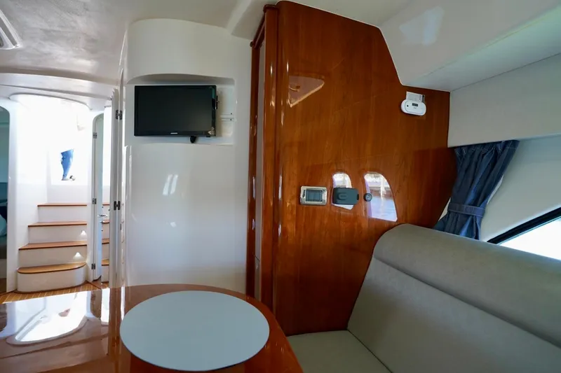 Slide: The Image of Interior of 2017 Intrepid 475 Sport Yacht with wood paneling and modern amenities. - 62