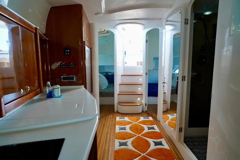 Slide: The Image of Interior of 2017 Intrepid 475 Sport Yacht with modern design and wooden cabinetry. - 67