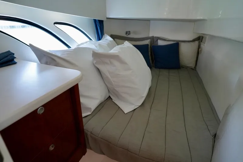 Slide: The Image of Cozy cabin interior of 2017 Intrepid 475 Sport Yacht with plush bedding and elegant design. - 71