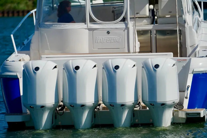 Slide: The Image of 2017 Intrepid 475 Sport Yacht with four powerful outboard engines on water. - 9