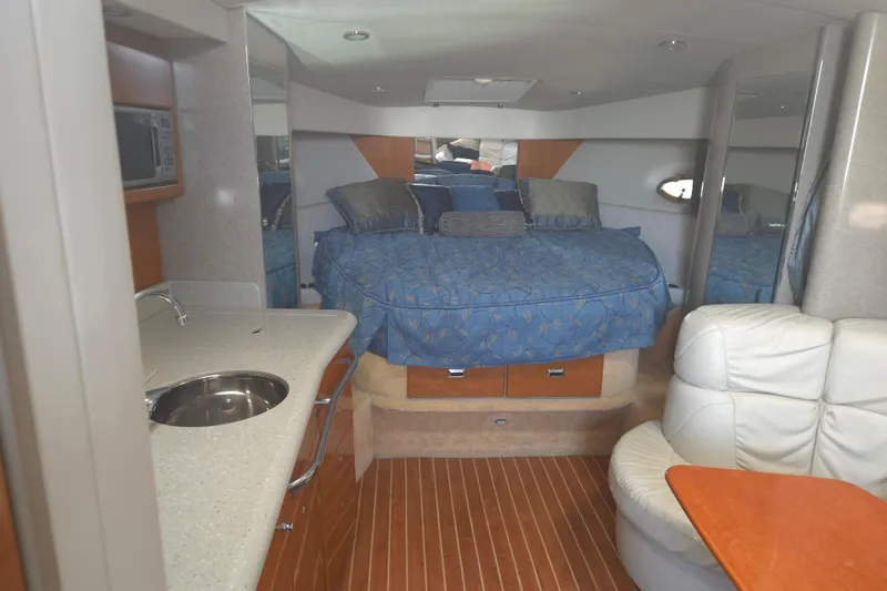 Slide: The Image of Interior of a 2005 Formula 37 Performance Cruiser with bed, kitchenette, and seating area. - 11