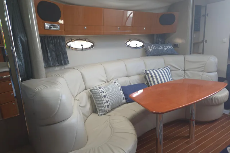 Slide: The Image of Luxurious interior of a 2005 Formula 37 Performance Cruiser with plush seating and elegant table. - 15