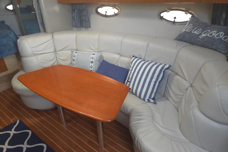 Slide: The Image of Interior of 2005 Formula 37 Performance Cruiser with leather seating and wooden table. - 16