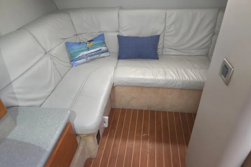 Slide: The Image of Interior of 2005 Formula 37 Performance Cruiser with white leather seating and decorative pillows. - 17