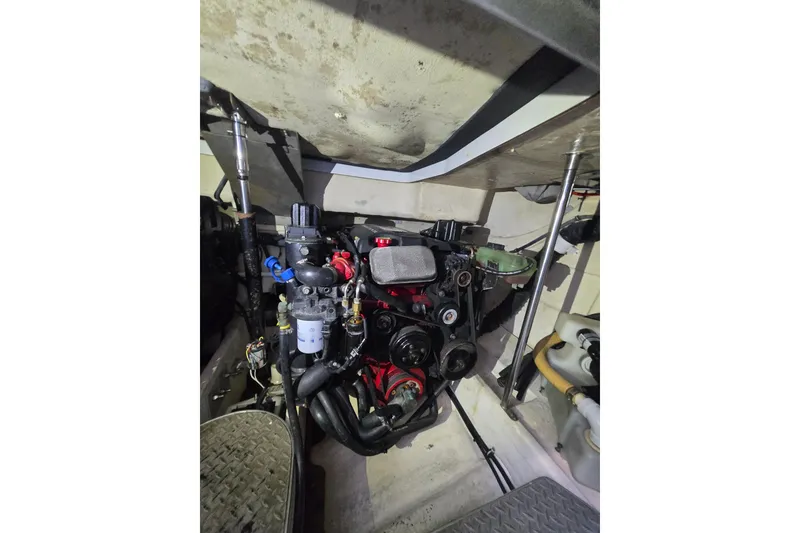 Slide: The Image of Engine compartment of a 2005 Formula 37 Performance Cruiser, showcasing mechanical components. - 24