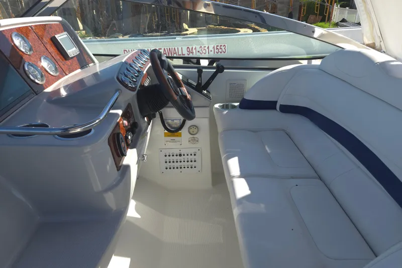 Slide: The Image of Interior of a 2005 Formula 37 Performance Cruiser with sleek dashboard and comfortable seating. - 26