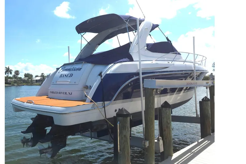 Slide: The Image of 2005 Formula 37 Performance Cruiser docked, featuring sleek design and blue accents. - 36