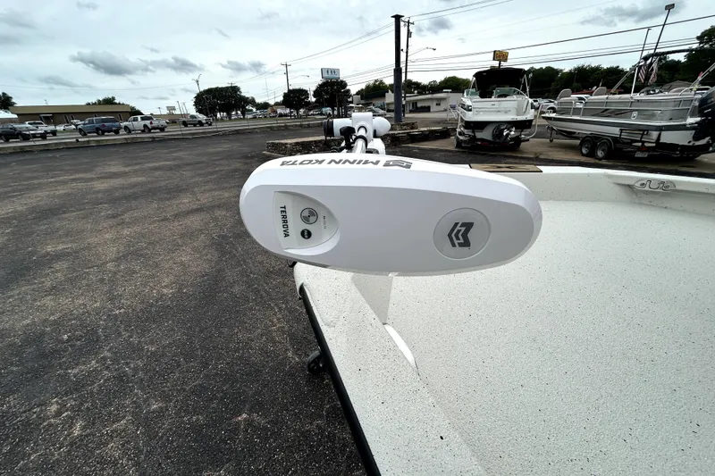 Slide: The Image of 2026 Xpress H20B Bay boat with Minn Kota Terrova trolling motor in a dealership lot. - 14