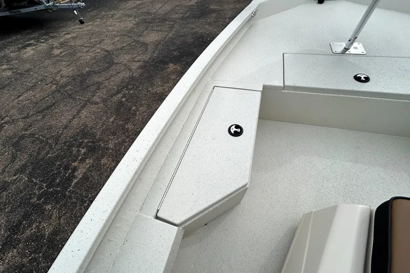 Slide: The Image of 2026 Xpress H20B Bay boat interior with storage compartments on a textured surface. - 16