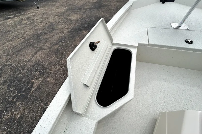 Slide: The Image of 2026 Xpress H20B Bay boat storage compartment open on deck. - 17