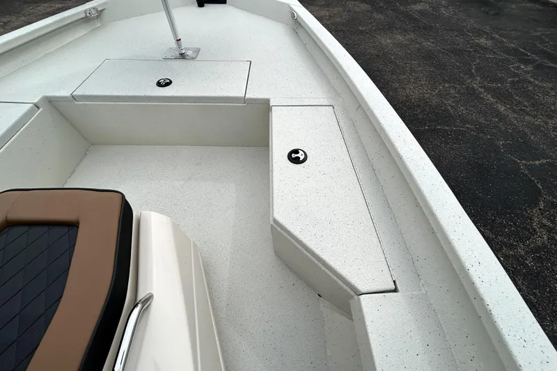 Slide: The Image of 2026 Xpress H20B Bay boat interior with seating and storage compartments. - 20