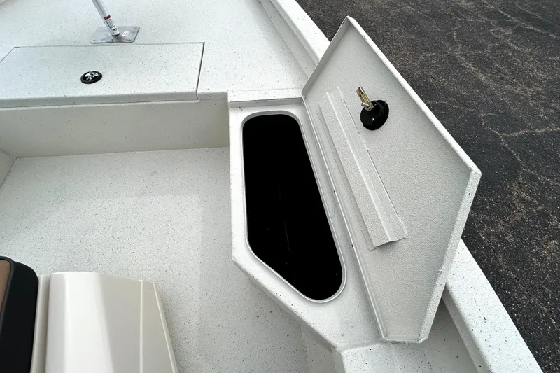 Slide: The Image of Open storage compartment on 2026 Xpress H20B Bay boat deck. - 21