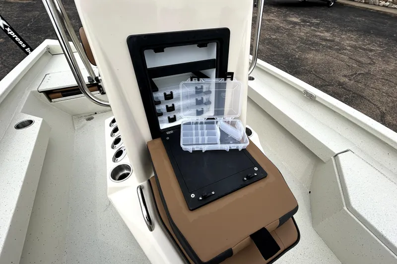 Slide: The Image of 2026 Xpress H20B Bay boat interior with open storage compartment and tackle box. - 23