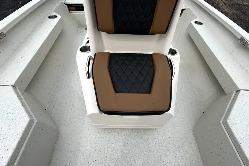 Slide: The Image of 2026 Xpress H20B Bay boat interior with cushioned seating and cup holders. - 24