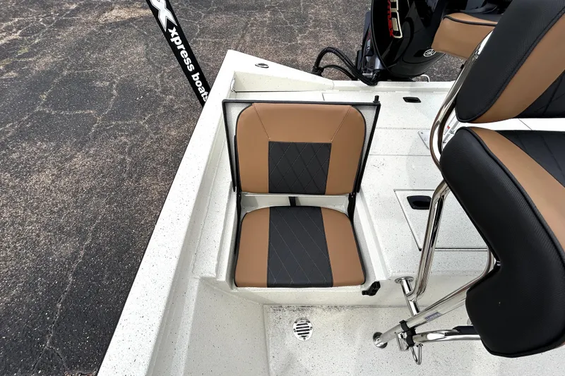 Slide: The Image of 2026 Xpress H20B Bay boat with tan and black seating, featuring sleek design. - 30