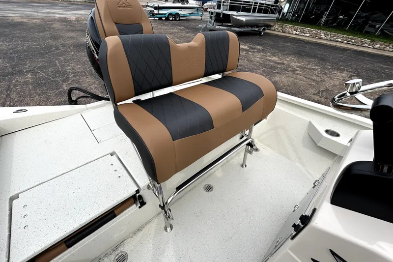 Slide: The Image of 2026 Xpress H20B Bay boat with stylish tan and black seating. - 32