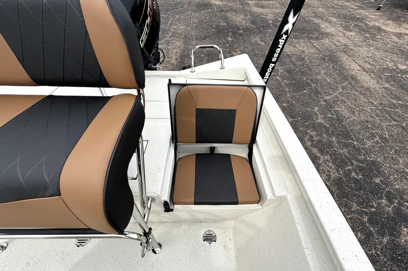 Slide: The Image of 2026 Xpress H20B Bay boat seats with black and brown upholstery. - 35
