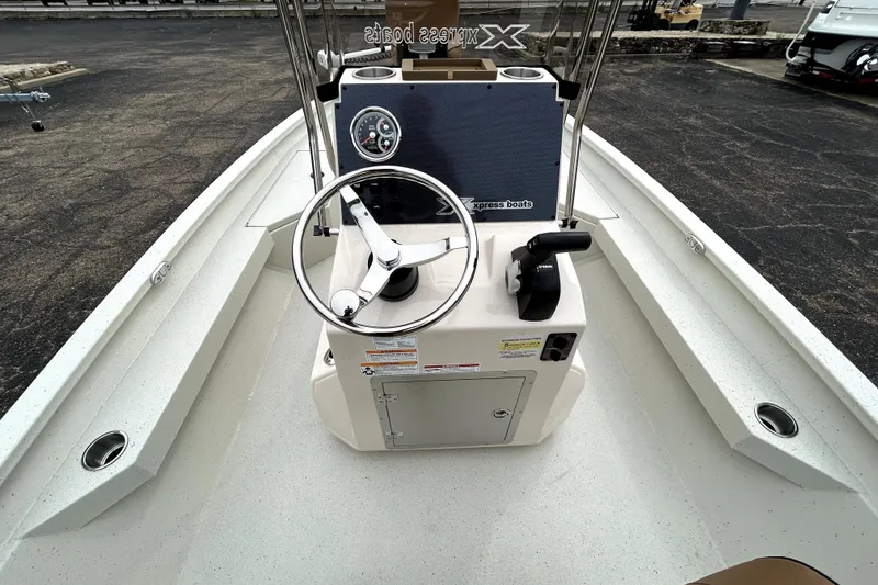 Slide: The Image of 2026 Xpress H20B Bay boat interior with steering wheel and control panel. - 37