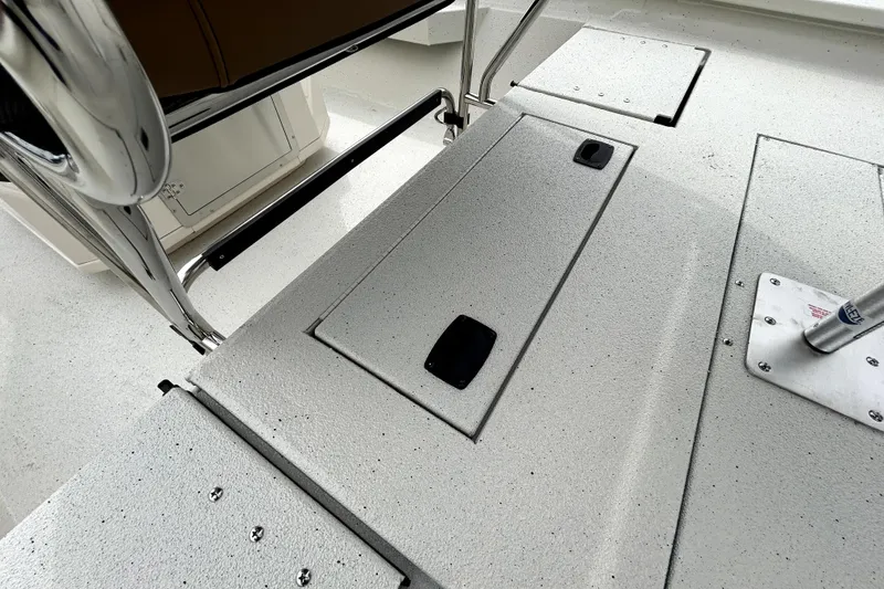 Slide: The Image of 2026 Xpress H20B Bay boat deck with storage compartments and stainless steel fittings. - 40
