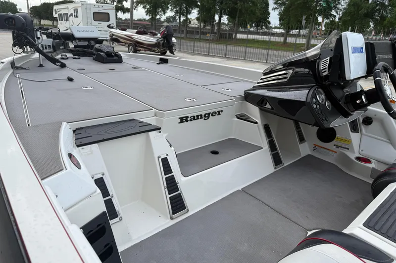 Slide: The Image of 2016 Ranger Z518C Intracoastal boat interior with advanced navigation equipment and spacious deck. - 11