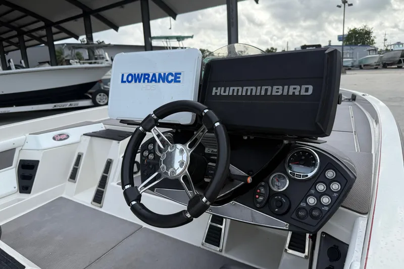 Slide: The Image of 2016 Ranger Z518C Intracoastal boat dashboard with Lowrance and Humminbird electronics. - 13