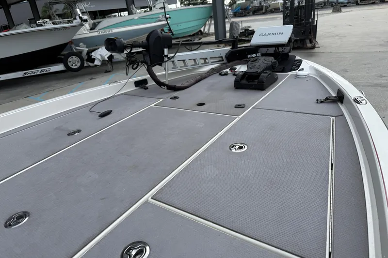 Slide: The Image of 2016 Ranger Z518C Intracoastal boat deck with Garmin equipment in a marina setting. - 14