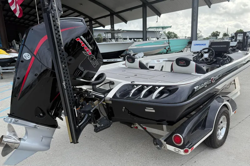 Slide: The Image of 2016 Ranger Z518C Intracoastal boat with Mercury Pro XS engine, parked on a trailer. - 4