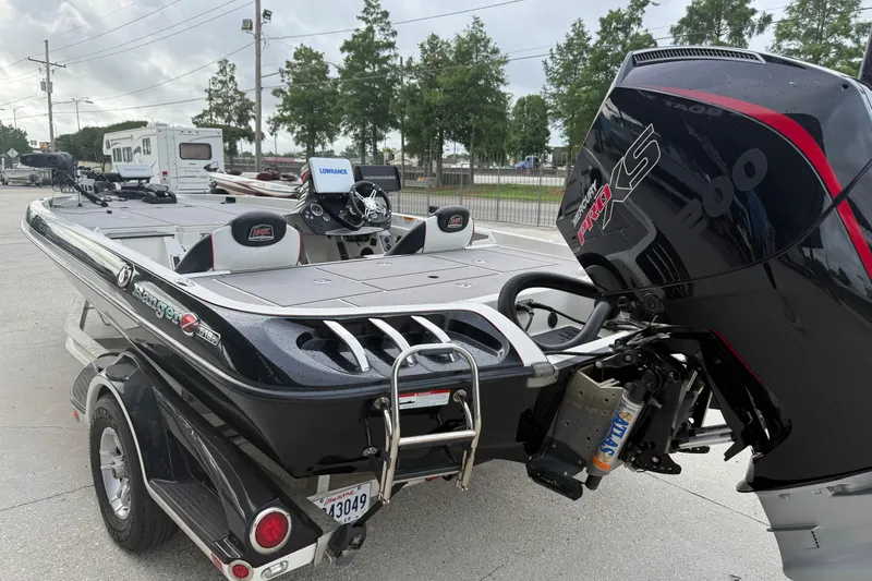 Slide: The Image of 2016 Ranger Z518C Intracoastal boat with Mercury Pro XS engine, parked outdoors. - 5