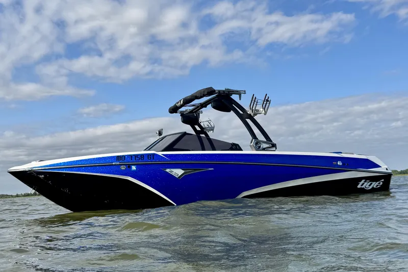 The Image of 2021 Tigé Z3 boat on water under a partly cloudy sky. - 0