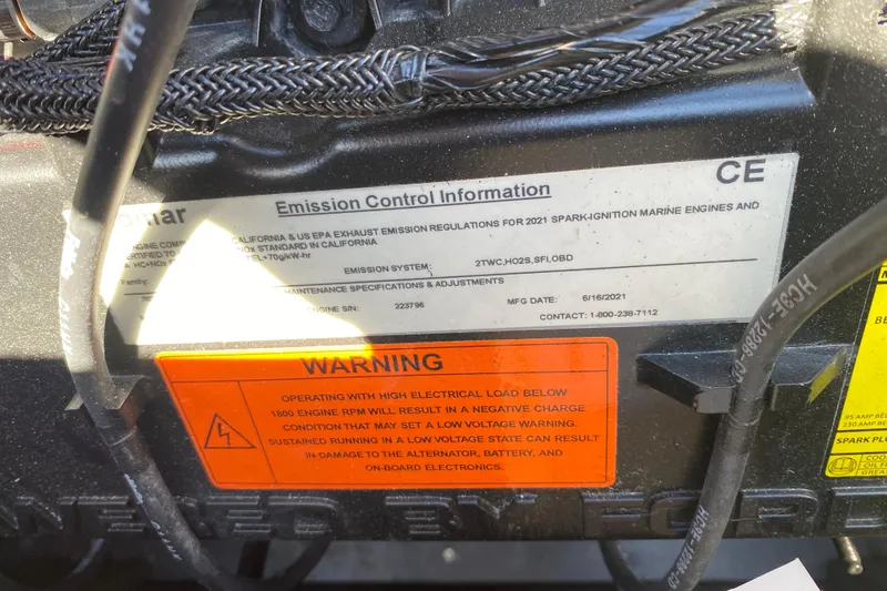 Slide: The Image of Emission control and warning labels on 2021 Tigé Z3 marine engine. - 13