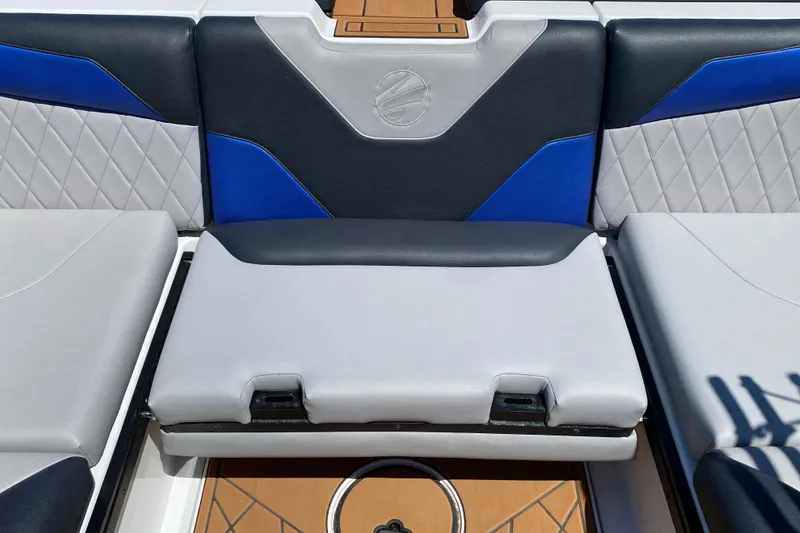 Slide: The Image of 2021 Tigé Z3 boat interior with blue and gray cushioned seating. - 14