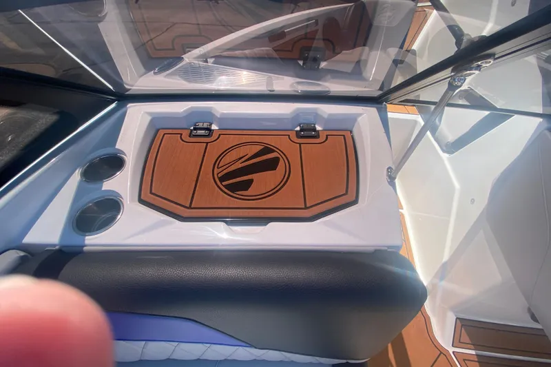 Slide: The Image of 2021 Tigé Z3 boat interior with wood accents and cup holders. - 20