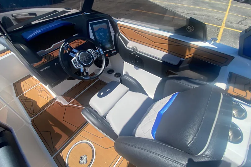 Slide: The Image of Interior of a 2021 Tigé Z3 boat featuring a modern dashboard and luxurious seating. - 30