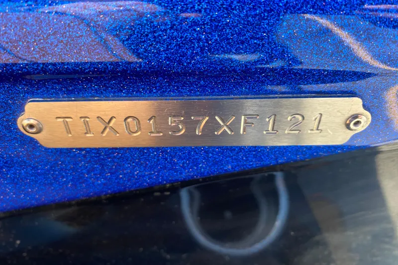 Slide: The Image of 2021 Tigé Z3 boat hull identification number on metallic blue surface. - 5