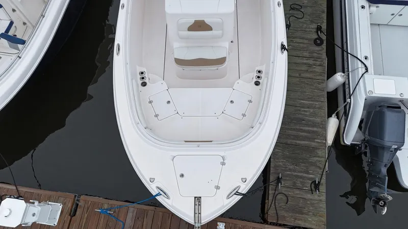 Slide: The Image of Overhead view of a 2015 Edgewater 280CC boat docked at a marina. - 8