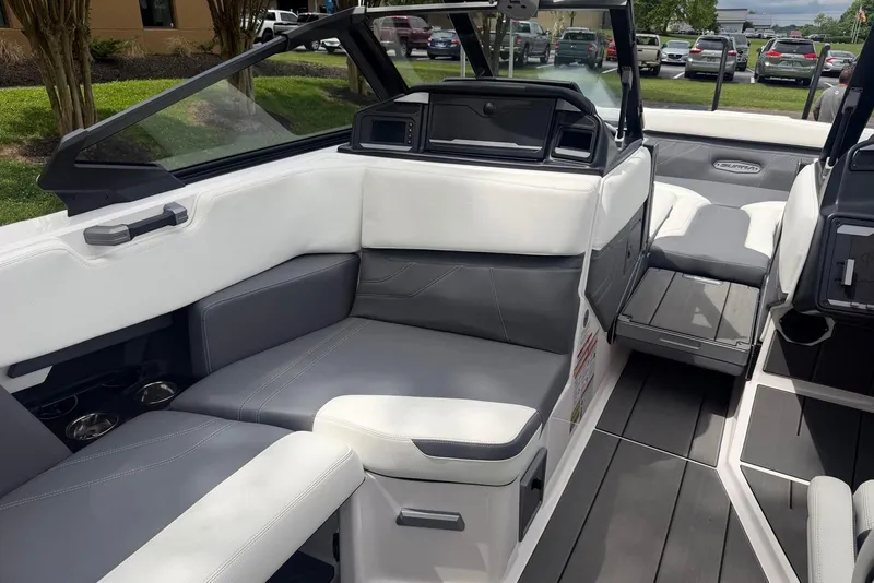 Slide: The Image of 2024 Supra SE 550 boat interior with sleek white and gray seating. - 10