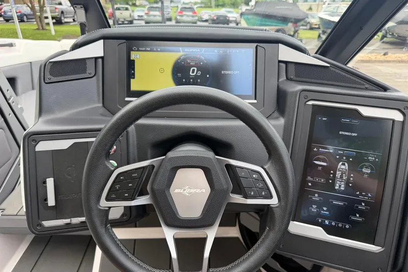 Slide: The Image of 2024 Supra SE 550 dashboard with advanced digital displays and steering wheel controls. - 12