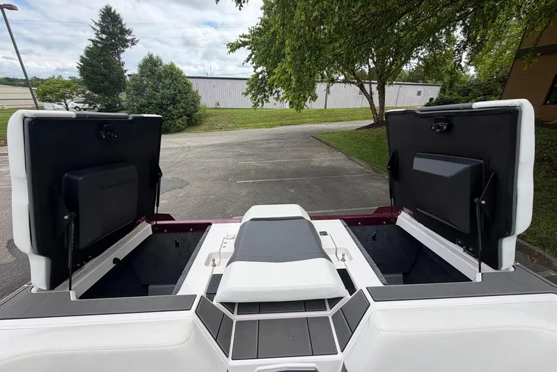 Slide: The Image of 2024 Supra SE 550 boat interior with open storage compartments, showcasing sleek design and functionality. - 15