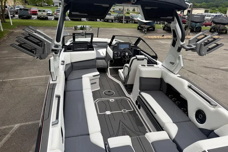 Slide: The Image of 2024 Supra SE 550 boat interior with sleek seating and advanced dashboard features. - 8