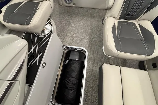 Slide: The Image of 2026 Barletta Corsa 23UC interior with open storage compartment and stylish seating. - 14