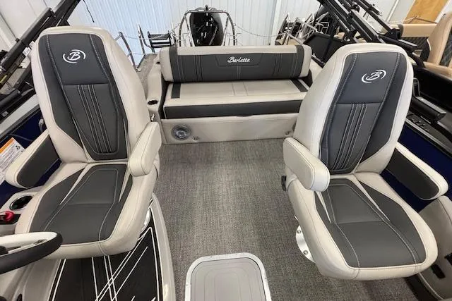 Slide: The Image of 2026 Barletta Corsa 23UC boat interior with two gray captain chairs and a rear bench seat. - 15