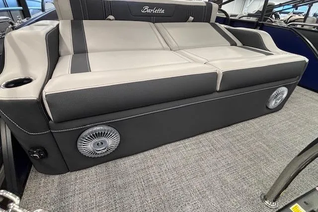 Slide: The Image of 2026 Barletta Corsa 23UC boat interior with cushioned seating and integrated speakers. - 22
