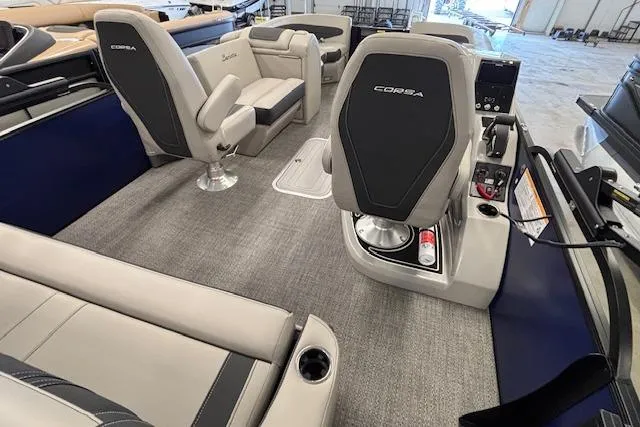 Slide: The Image of 2026 Barletta Corsa 23UC boat interior with modern seating and control panel. - 24