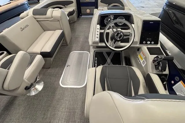 Slide: The Image of 2026 Barletta Corsa 23UC boat interior with modern helm and luxurious seating. - 25