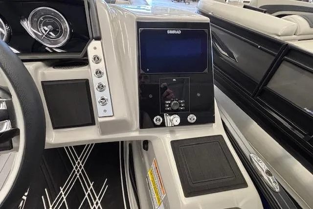 Slide: The Image of 2026 Barletta Corsa 23UC dashboard with Simrad display and modern controls. - 27
