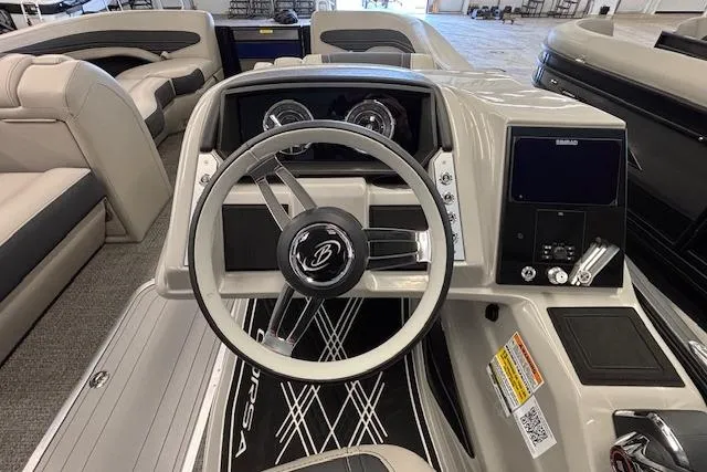 Slide: The Image of 2026 Barletta Corsa 23UC boat dashboard with steering wheel and control panel. - 28