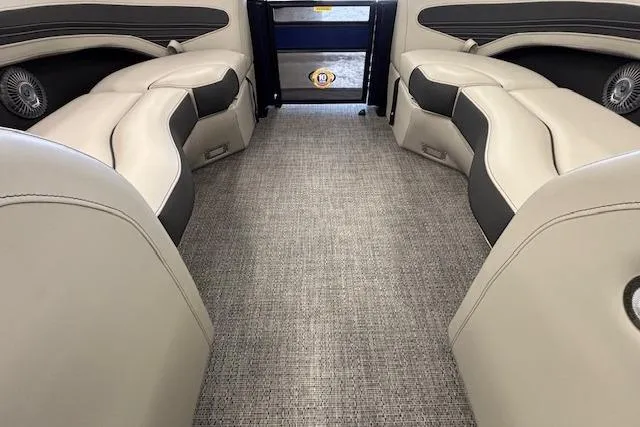 Slide: The Image of Interior of 2026 Barletta Corsa 23UC pontoon boat with plush seating and carpeted flooring. - 32